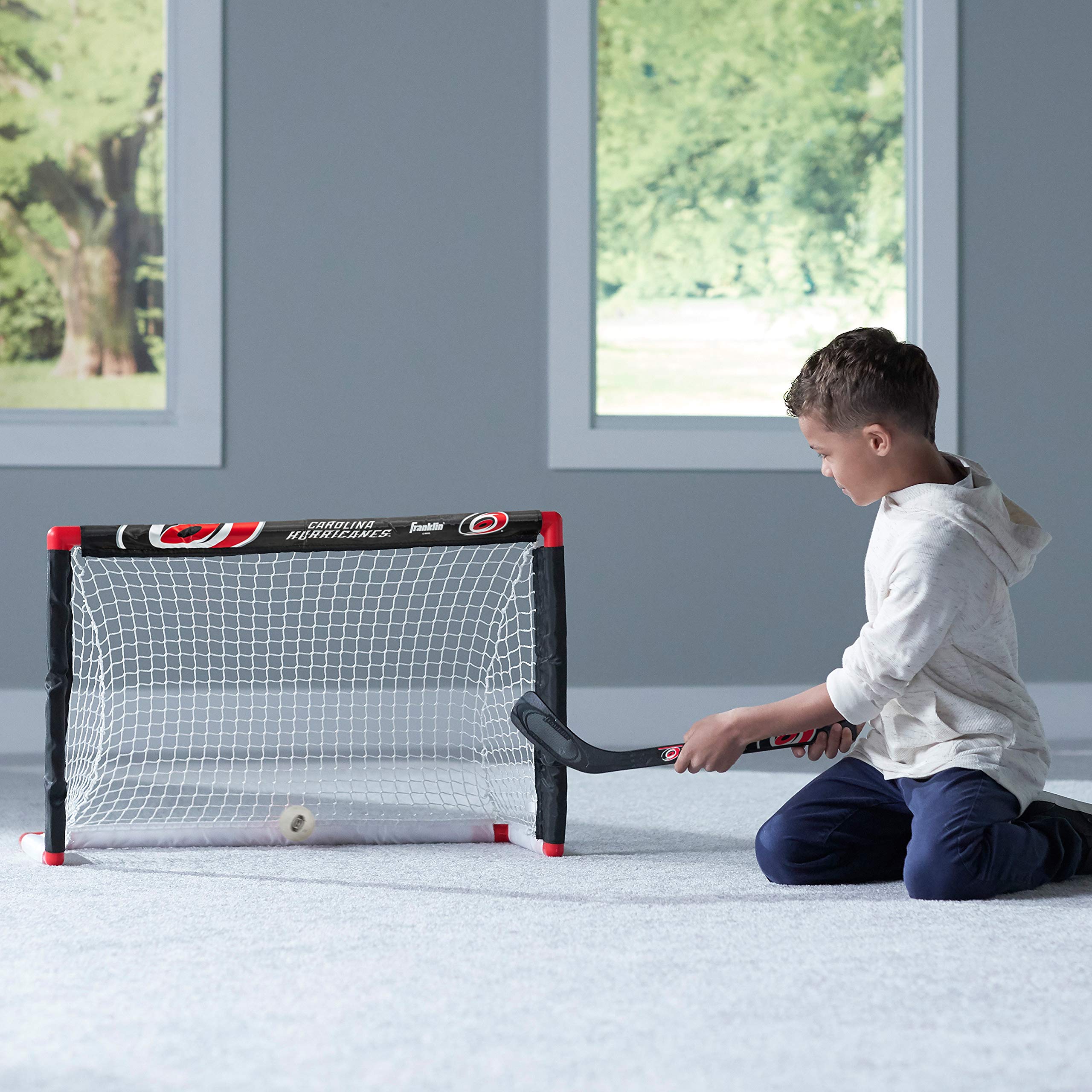 Franklin Sports Carolina Hurricanes Mini Hockey Set - Knee Hockey Goal, Ball, & 2 Hockey Stick Combo Set - Mini Goal Net - Nhl O